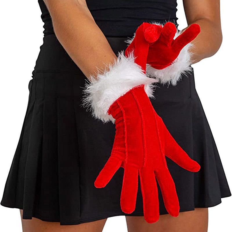 A set of holiday gloves in vibrant red velvet - perfect for adding a festive touch to your Christmas party outfit.