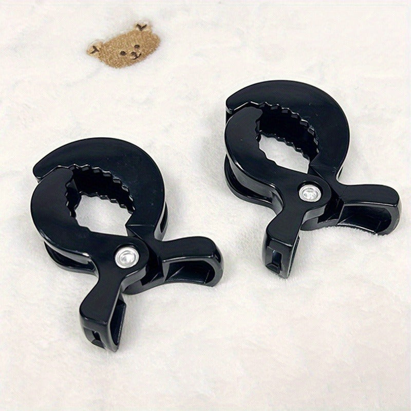 2 pieces of stroller blanket clips made of sturdy ABS material, ideal for travel and gifting purposes.