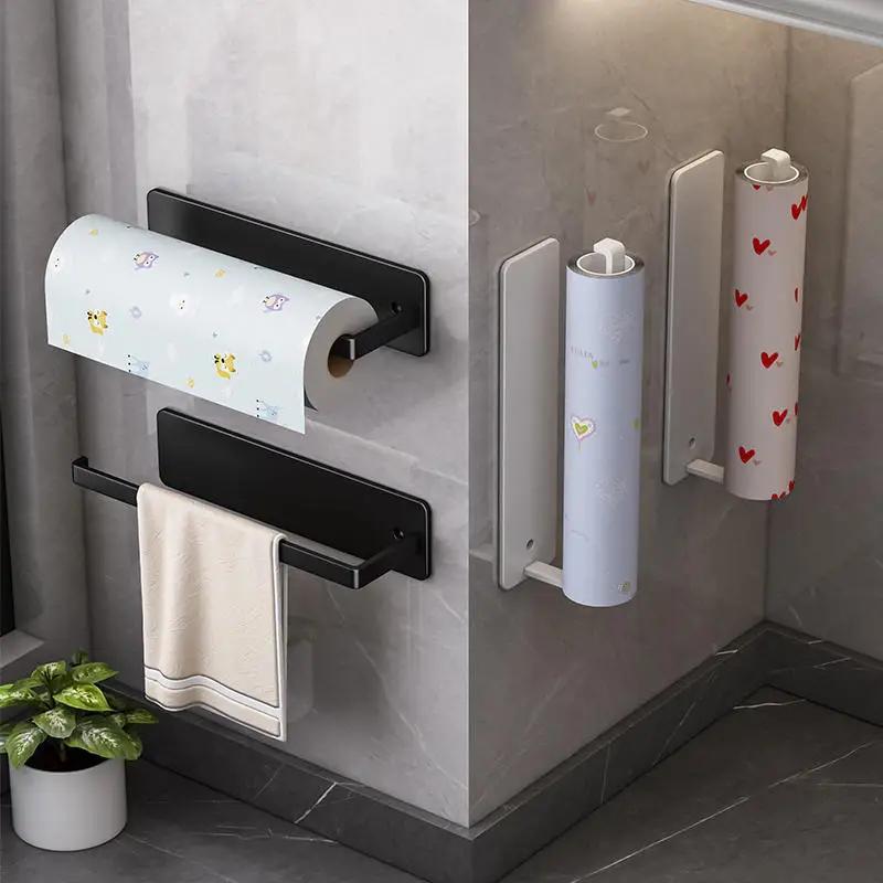 Kitchen organizer made of stainless steel that can be wall-mounted, available in black, white, or grey. Includes holders for paper towels and dish towels, as well as a shelf for plastic film. Features a space-saving design.