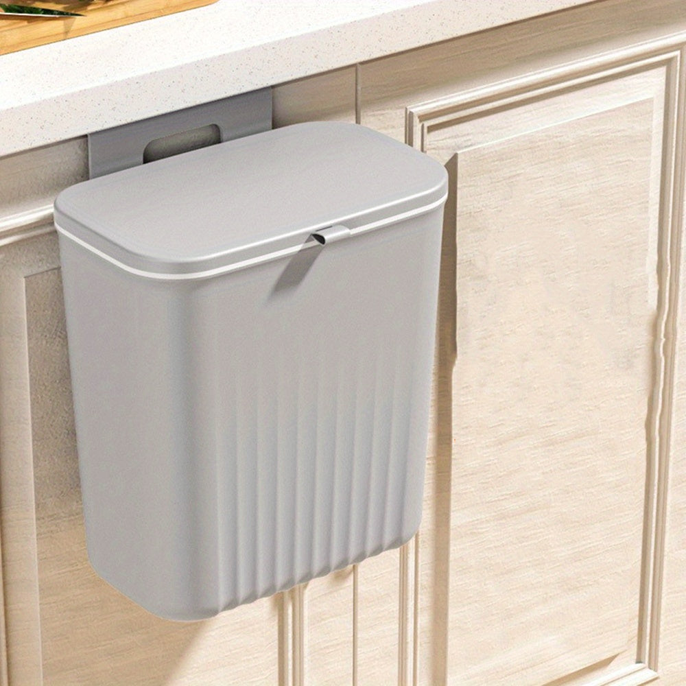 Wall mounted trash can with adhesive hook, large capacity hanging bin for kitchen organization. Perfect for home and office use.