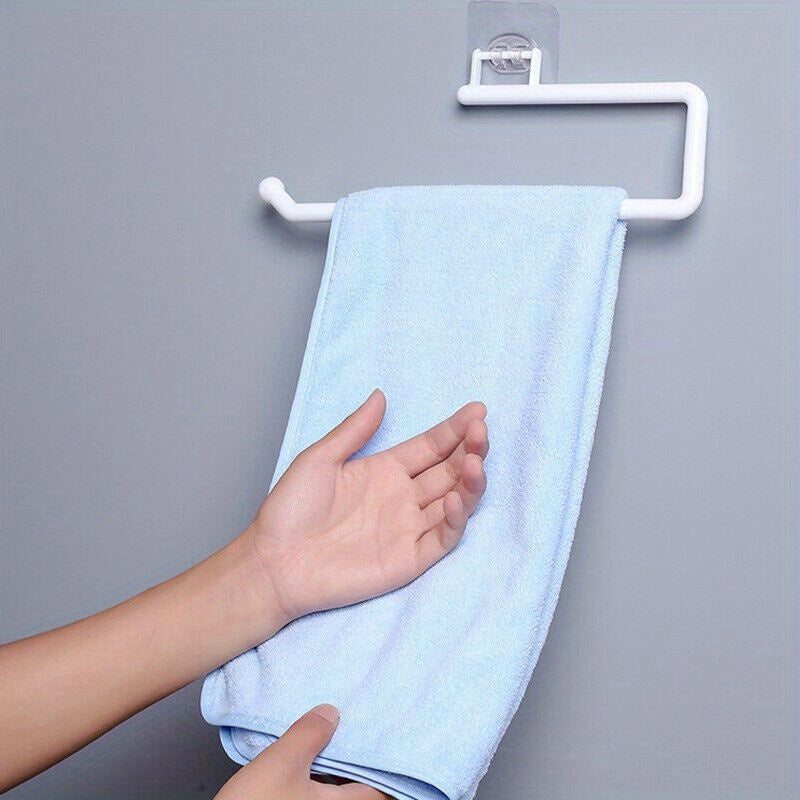 Paper towel holder for kitchen and bathroom, wall-mounted storage rack for towels and dish cloths. Punching-free installation. Made of plastic. Dimensions: 6.86 x 28.96 x 7.87cm. Includes 1 piece. Ideal for kitchen supplies.