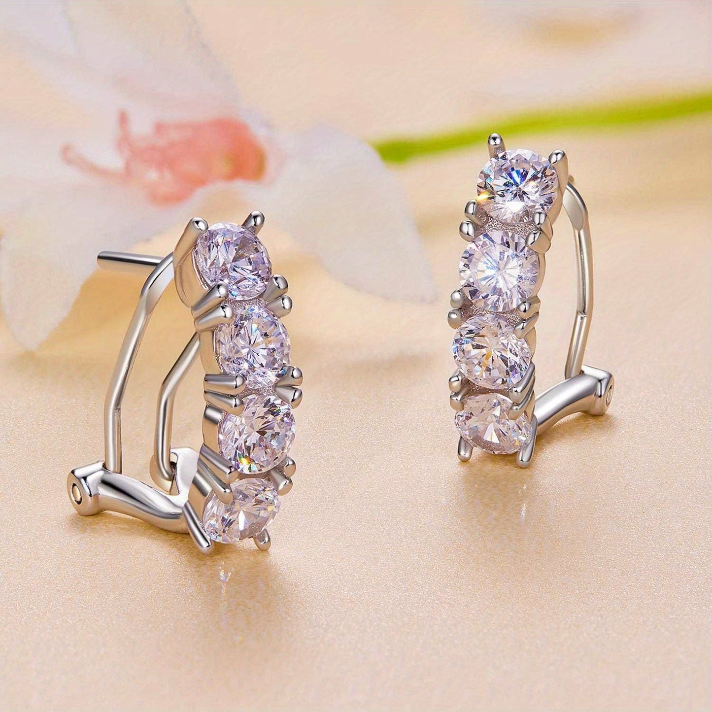 Pretty female wedding earrings with delicate hoop design made of hypoallergenic 925 sterling silver and inlaid with dazzling moissanite stones. Comes in a gift box, making it the perfect gift for any occasion.