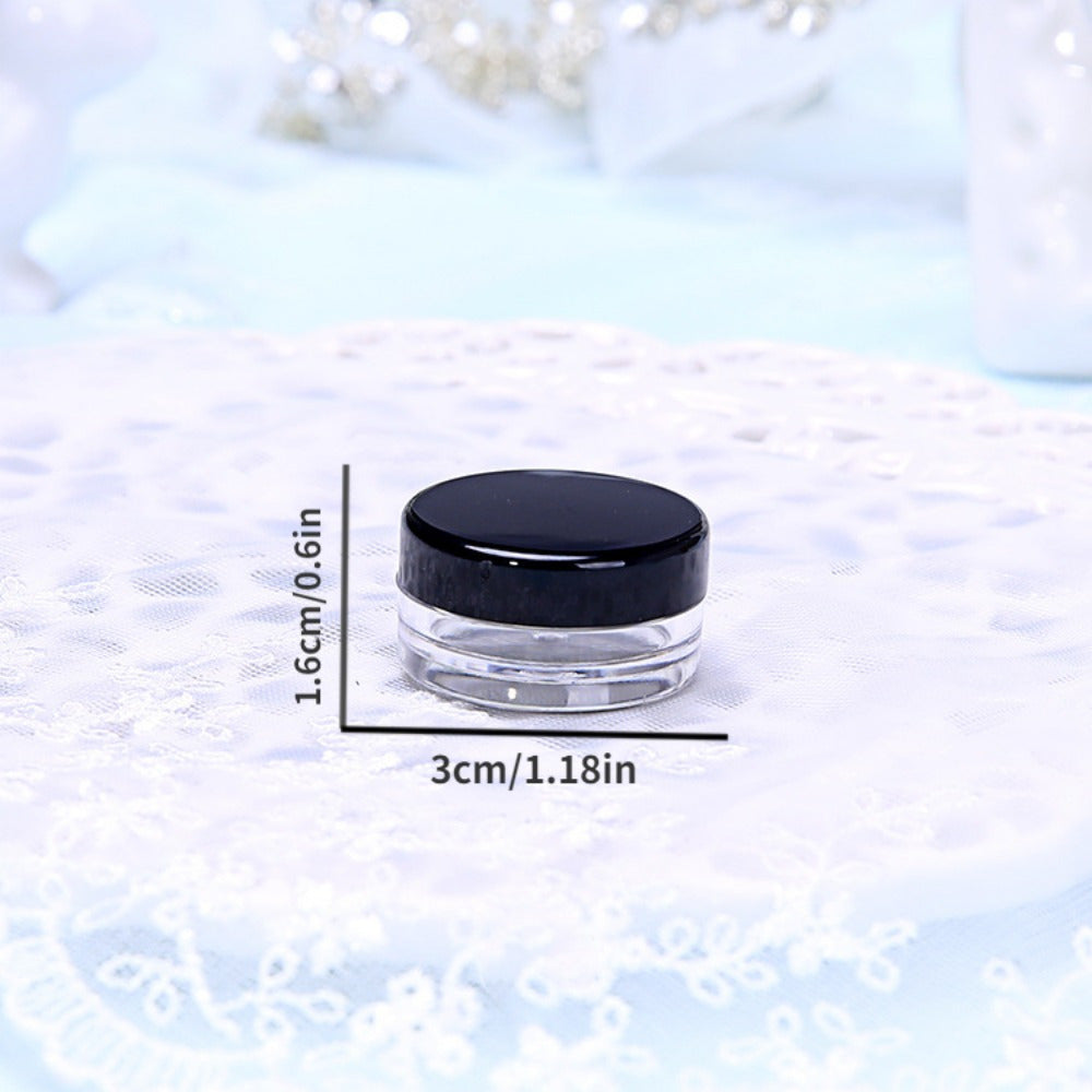 5 grams, transparent mini cream jars with black lids - pack of 10/50. Ideal for storing eyeshadow cream, lip balm, or other cosmetic samples while on the go. Perfect travel essential for beauty enthusiasts.