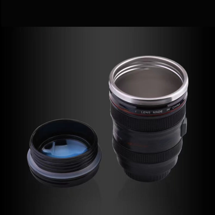 Stainless steel camera lens coffee mug with retractable lid, realistic SLR design. BPA-free ABS plastic. Ideal gift for photographers. Multipurpose travel cup. Hand wash only. Novelty drinkware.