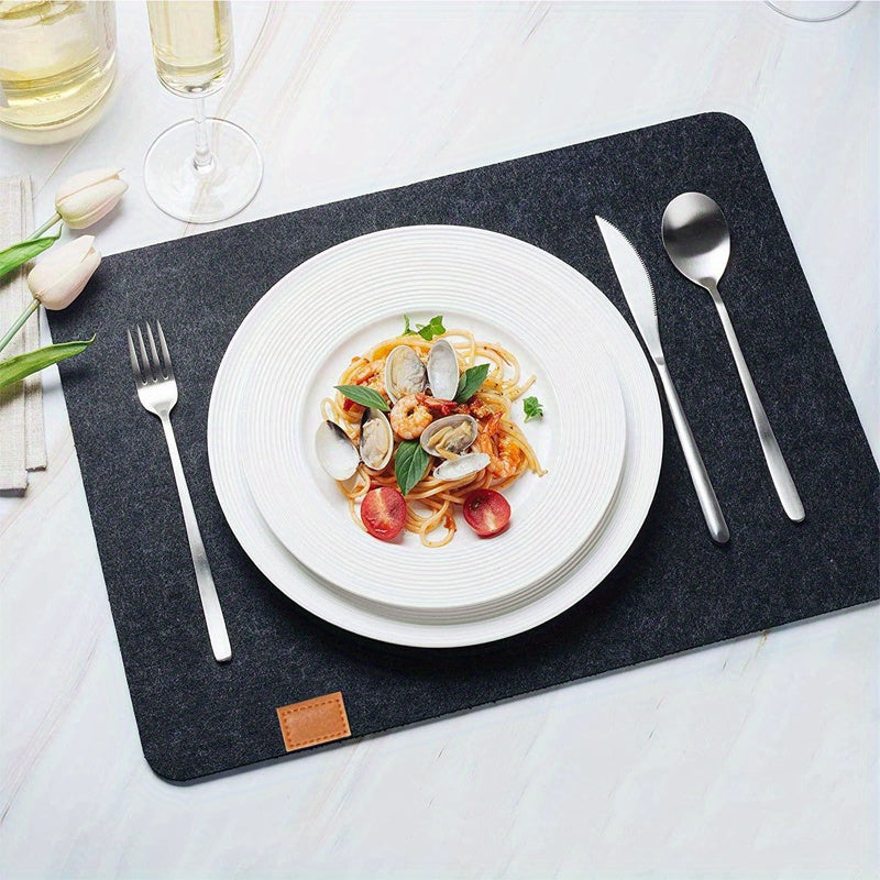 12-piece dining table decor set includes wipe-clean felt placemats, washable place mats, coasters, and cutlery bag. Ideal for kitchen and dining room.