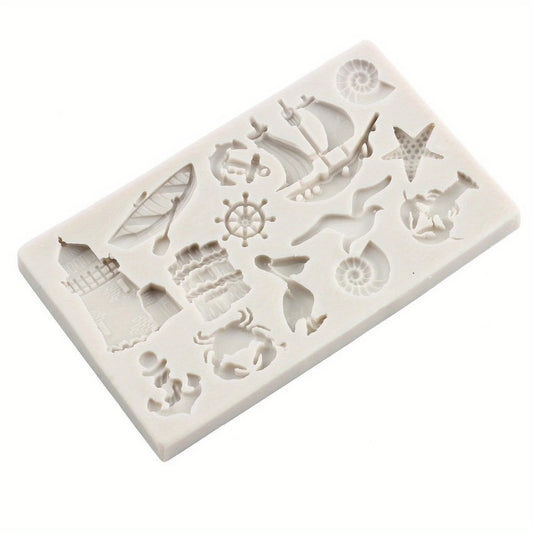 Silicone mold featuring a sailboat anchor and birds, perfect for creating sea animals cupcake toppers and fondant cake decorations. Great for chocolate, gumpaste, and other decorating tools.