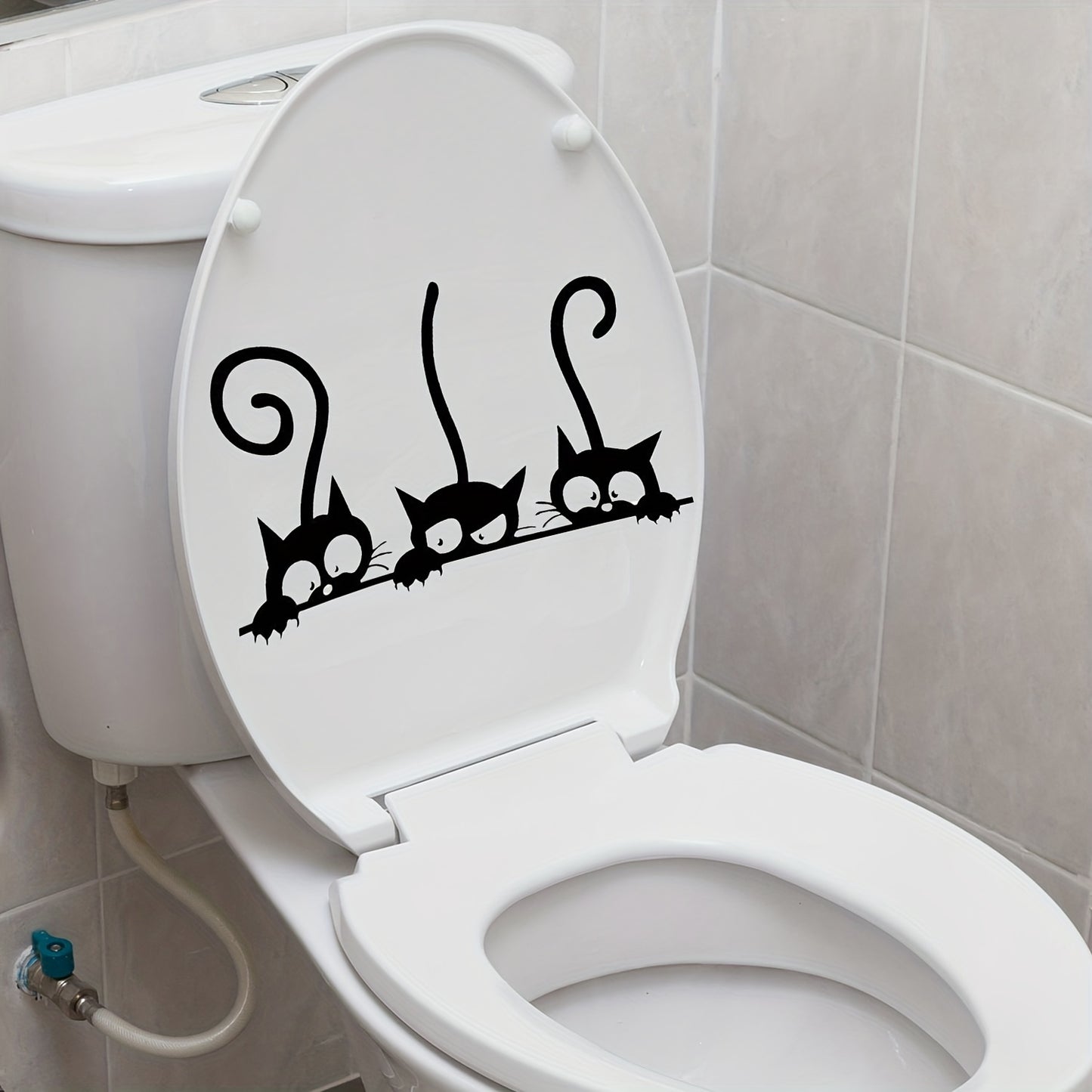 Adorable black cat decals for toilet lids: waterproof and easy to apply for bathroom humor.