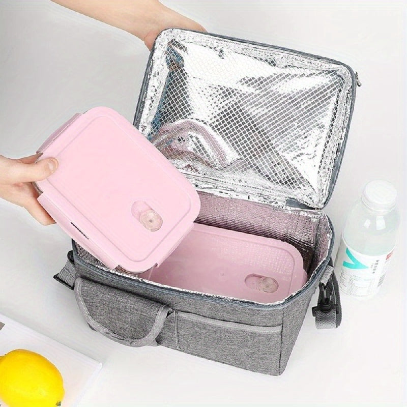 This lunch bag is designed with double layers, providing ample space for your meals. It is insulated to keep your food fresh during picnics or lunches. The bag also includes a separate compartment for bottles and is leakproof with a zipper closure. It