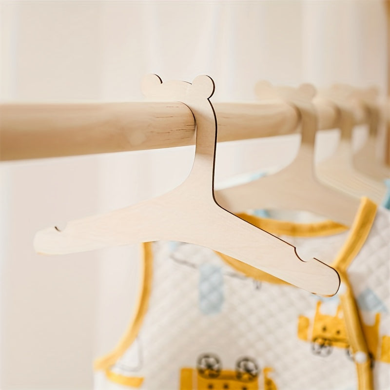 Get 5 or 10 charming bear-shaped wooden hangers that are durable and perfect for organizing your clothes at home. These small hangers are ideal for bedrooms, wardrobes, homes, and even dormitories. You can use them as wardrobe organizers, closet