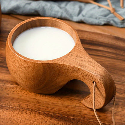 Acacia wood coffee and milk cup with tassel. High-quality, reusable drinkware with rope handle. Perfect for camping and daily use in the kitchen.