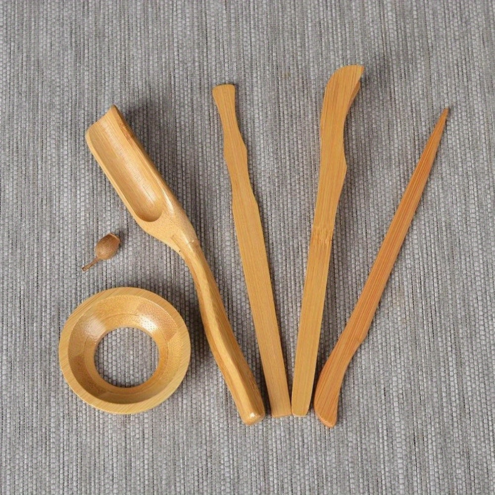 Complete set of Wooden Tea Ceremony Utensils including Bamboo Tea Spoons, Tea Needle, Tea Tweezers Clip, Strainer Tong, and Tube Teaware. Perfect for use in your home, office, or tea room. Essential kitchen tools and tea accessories.