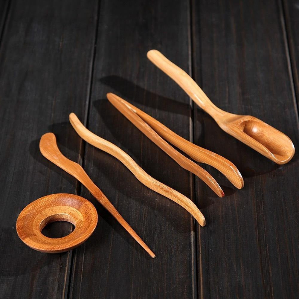 Complete set of Wooden Tea Ceremony Utensils including Bamboo Tea Spoons, Tea Needle, Tea Tweezers Clip, Strainer Tong, and Tube Teaware. Perfect for use in your home, office, or tea room. Essential kitchen tools and tea accessories.