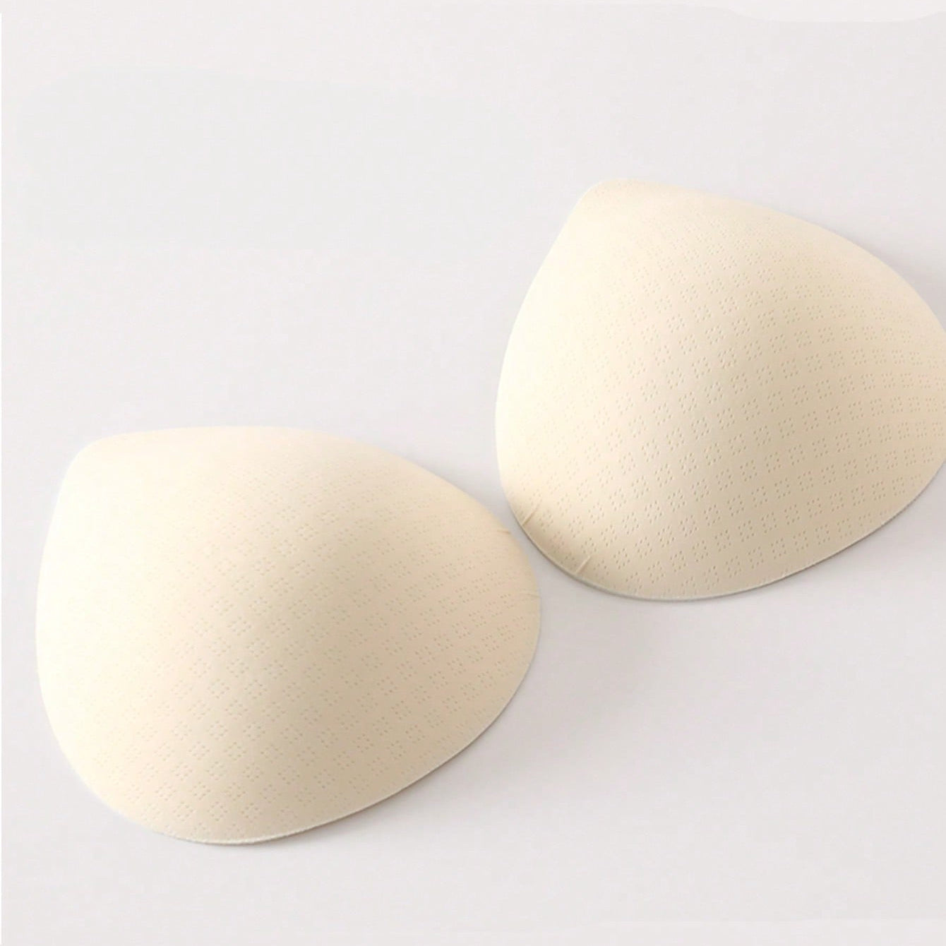 Reusable bra pads for fuller bust, made of 100% polyamide non-woven fabric. Invisible and seamless design for comfortable wear. Perfect for customizing women's underwear.