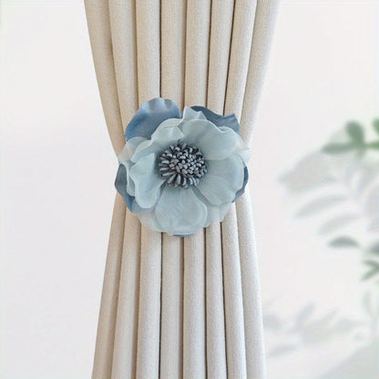 These magnetic curtain straps feature a simple yet stylish three-dimensional flower design. With a magnetic closure, they provide a convenient way to hold back your curtains in the bedroom, living room, kitchen, or any other room in your home. Perfect