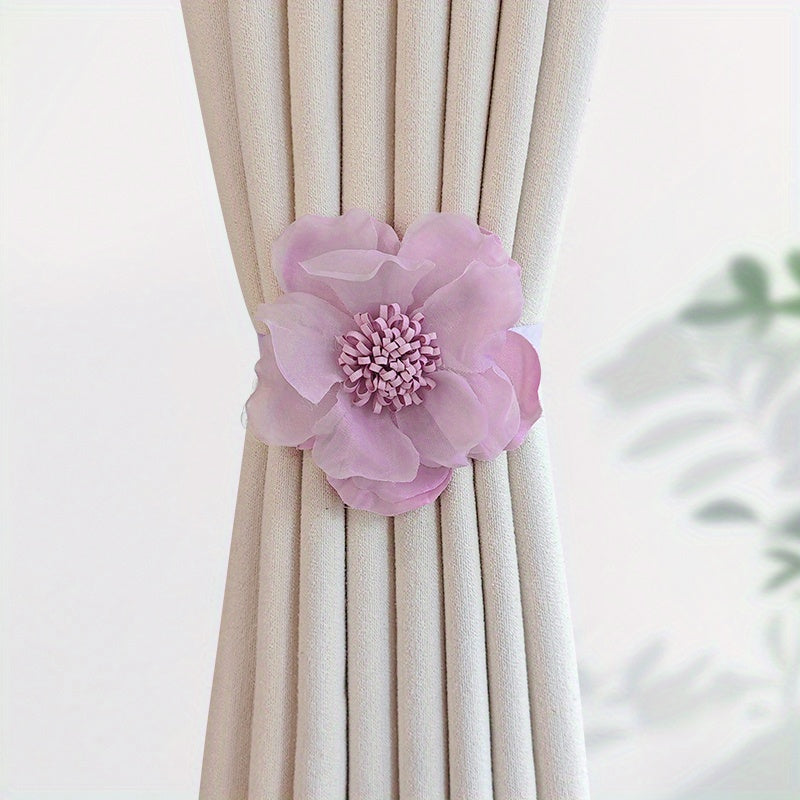 These magnetic curtain straps feature a simple yet stylish three-dimensional flower design. With a magnetic closure, they provide a convenient way to hold back your curtains in the bedroom, living room, kitchen, or any other room in your home. Perfect