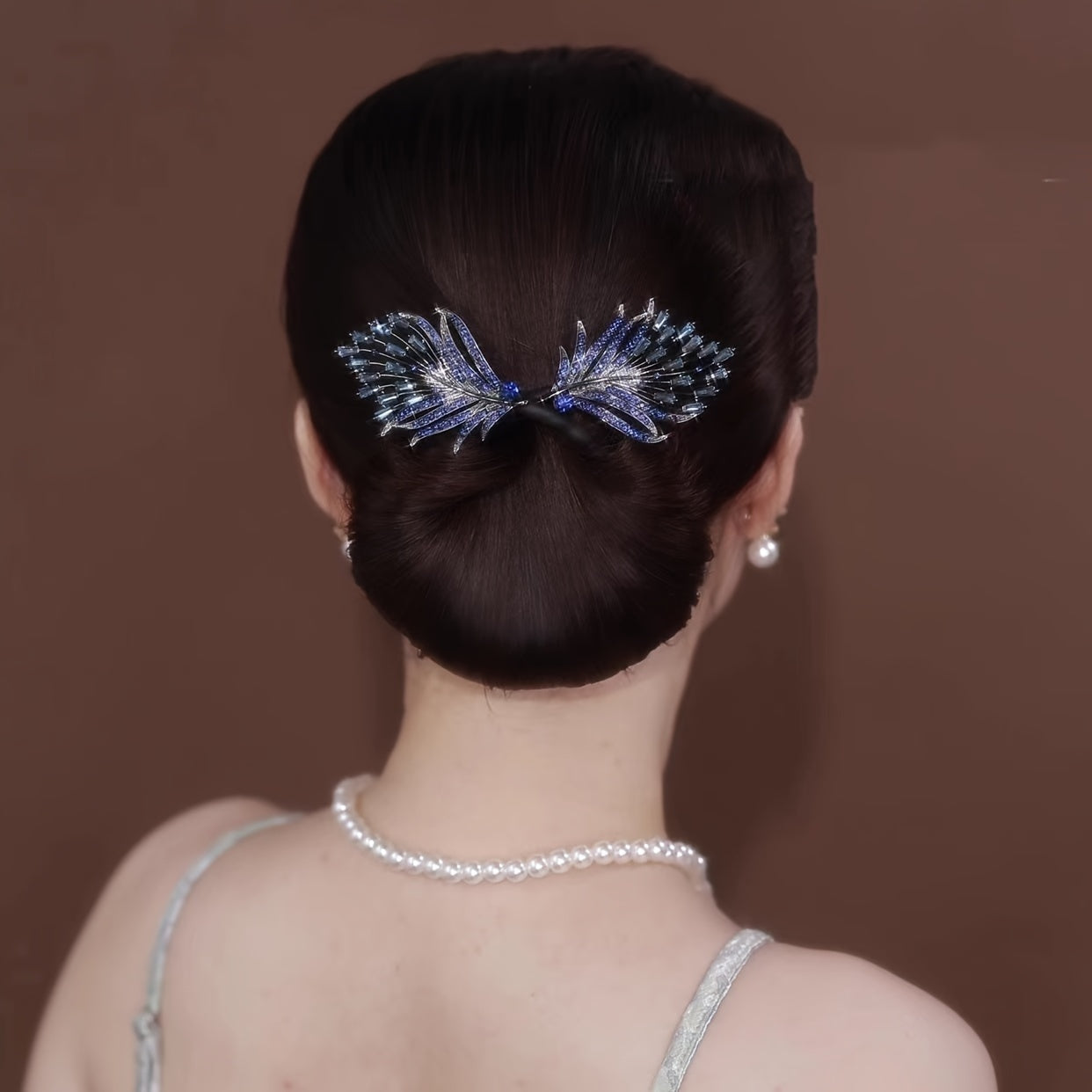 Feathered twist hair clip adorned with rhinestones