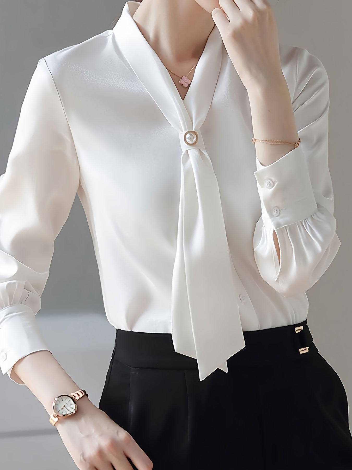 Beaded V-neck blouse with elegant long sleeves for spring and fall.