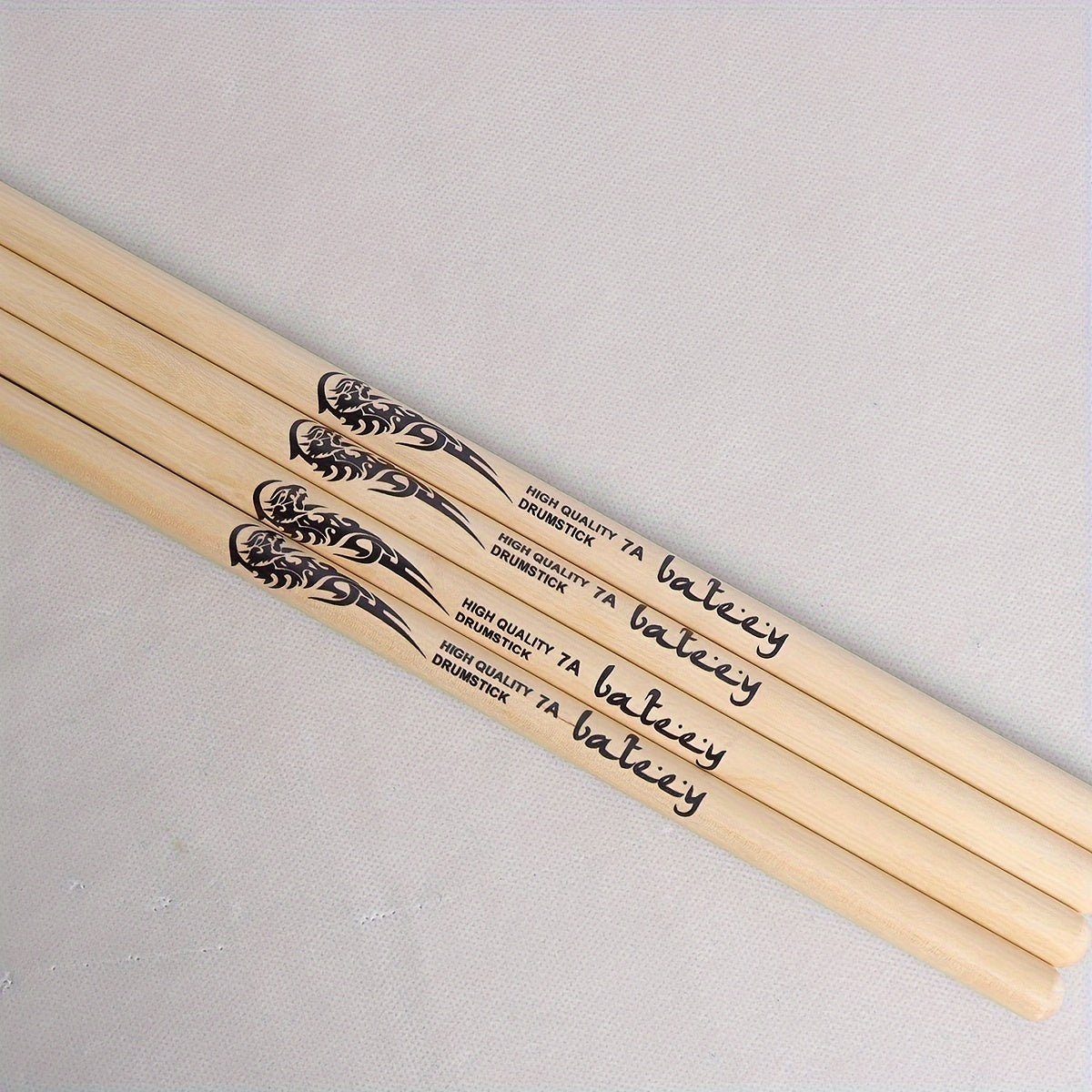 Lightweight drumsticks with totem design, selectable sizes 5A, 7A, and 5B. Made of high-quality natural wood with a precision grip, uncharged pair.