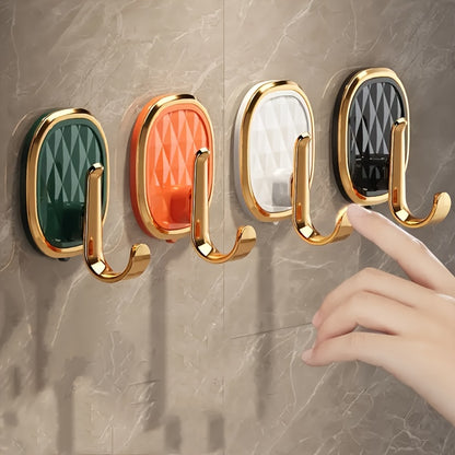 4 Golden Sticky Hooks for Easy Wall Mounting - Ideal for Clothes, Towels, and Robes in Modern Bathroom Decor.