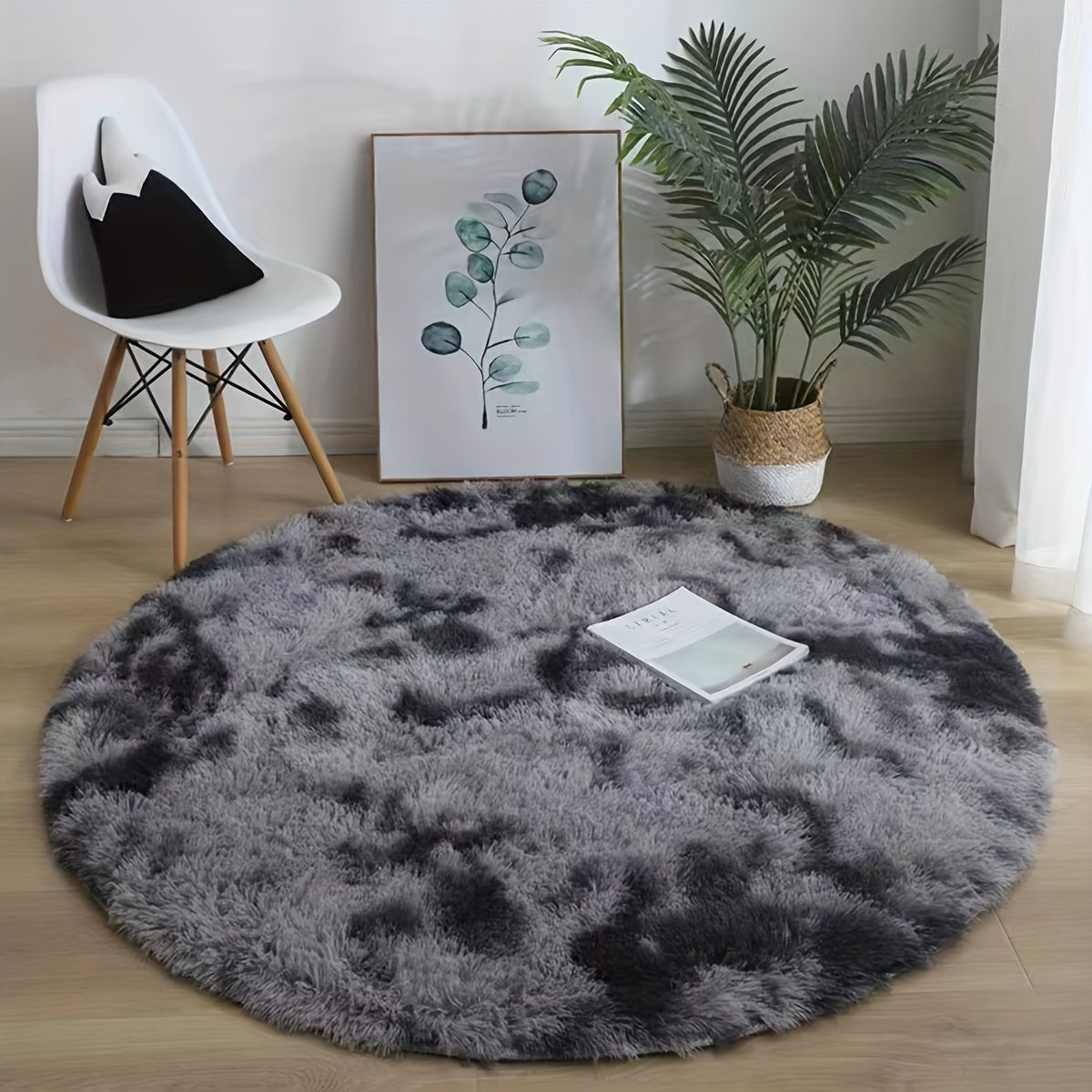 This cozy round area rug is perfect for adding a touch of softness to any room. Made with plush faux fur and lightweight knit polyester fiber, this super fluffy round mat has a rubber backing for extra durability. With a low pile and machine-made