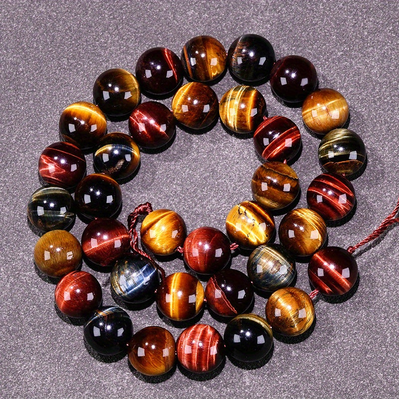 Loose round beads made from natural three-color Tiger Eye stone available for wholesale. Perfect for creating semi-finished DIY jewelry such as woven bracelets, necklaces, and sweater chains.