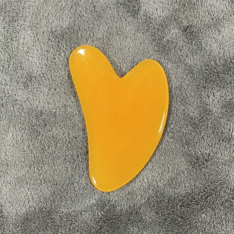 Heart-shaped resin Gua Sha tool for facial and full body hair removal, high-quality for beauty salon use.