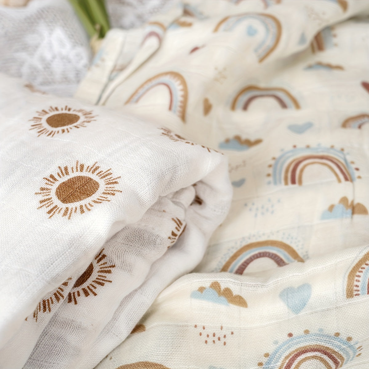 Three Elinfant Swaddle Blankets made from bamboo cotton muslin for newborns. These soft gauze bath towels are recommended for hand washing only and are suitable for children aged 0-3 years old.