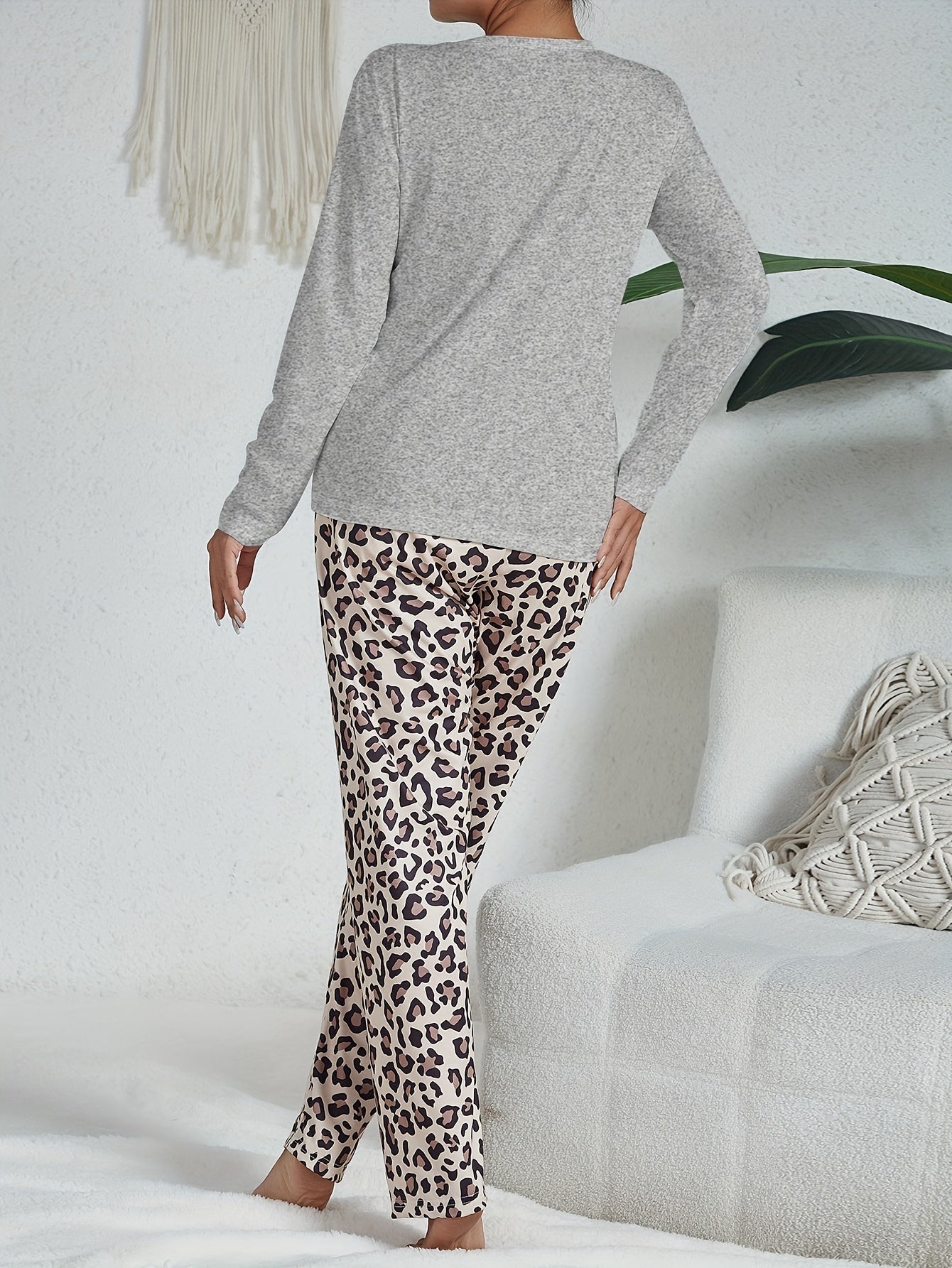 Casual leopard pajama set with long sleeve heart print top and pants for women's sleepwear and loungewear.