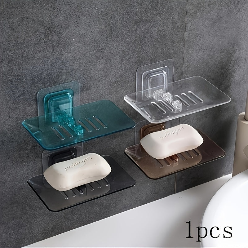 Wall-mounted soap dish with drainage, adhesive holder for bathroom organization.