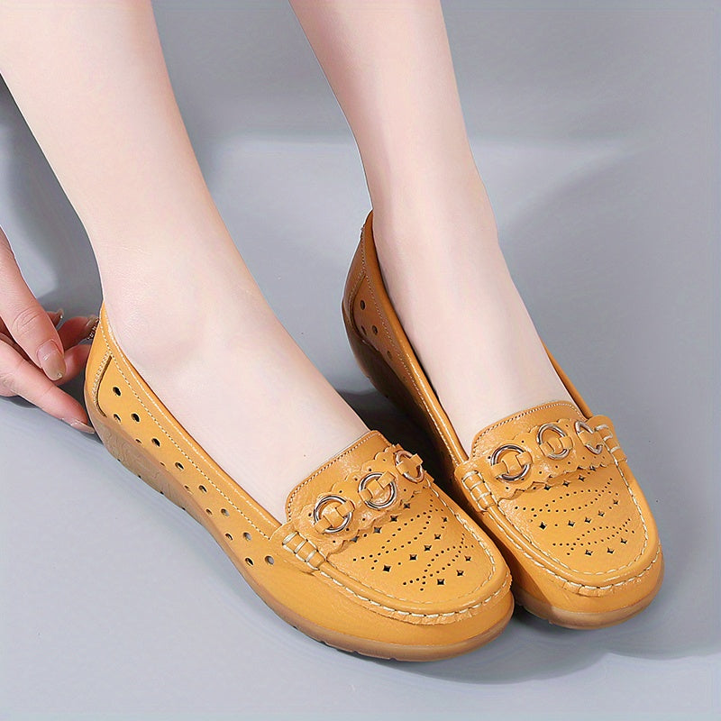 Flat shoes for women with hollow out design, casual and breathable slip-on style, providing comfortable wear.