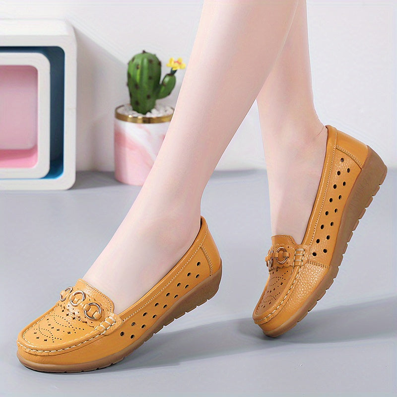 Flat shoes for women with hollow out design, casual and breathable slip-on style, providing comfortable wear.