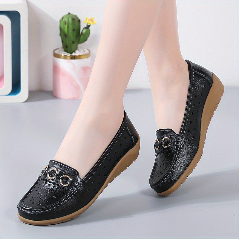 Flat shoes for women with hollow out design, casual and breathable slip-on style, providing comfortable wear.