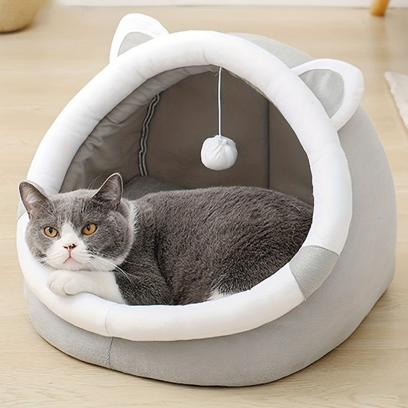 Cozy Cartoon Cat Cave Bed keeps your kitten warm and snug.