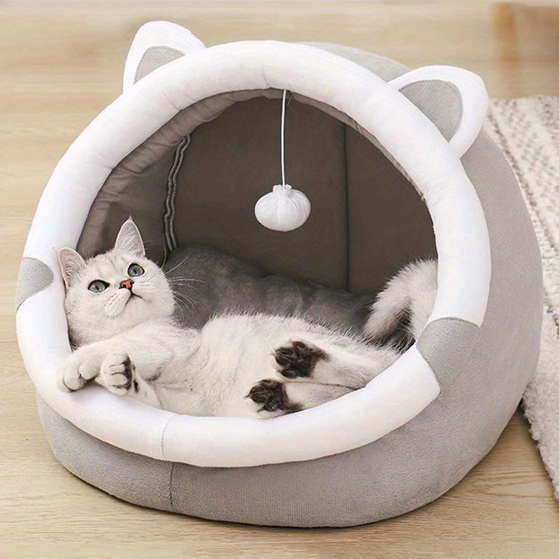 Cozy Cartoon Cat Cave Bed keeps your kitten warm and snug.