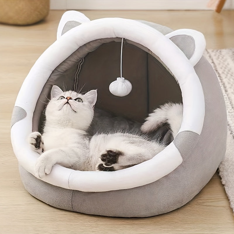 Cozy Cartoon Cat Cave Bed keeps your kitten warm and snug.