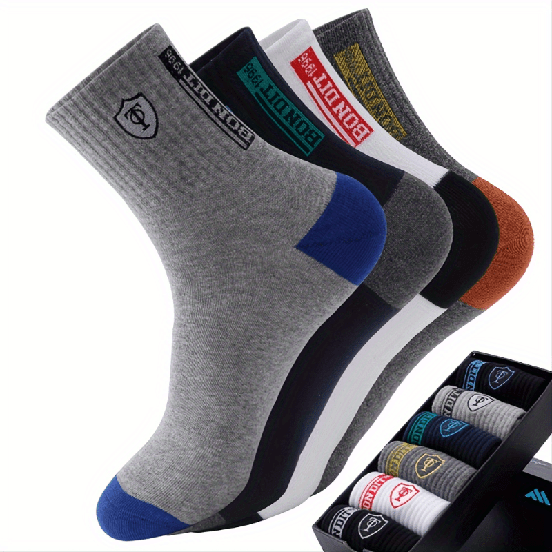 6 pairs of men's cotton sports socks with embroidered sweat-wicking knit fabric. Machine washable. Mixed colors. Unboxed.