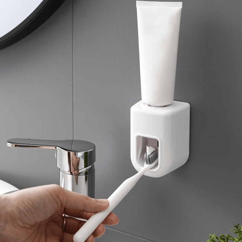 Automatic toothpaste dispenser for wall mounting. Simplifies toothpaste usage in the bathroom.