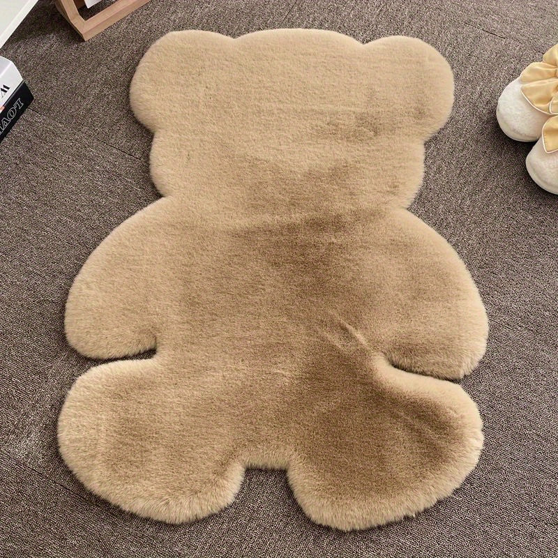 Bear-shaped area rug, featuring a cute animal pattern and fluffy cushioning, designed for softness and comfort. This soft furry throw carpet doubles as an anti-fatigue floor mat, perfect for use in high traffic areas. Ideal for adding a touch of spring