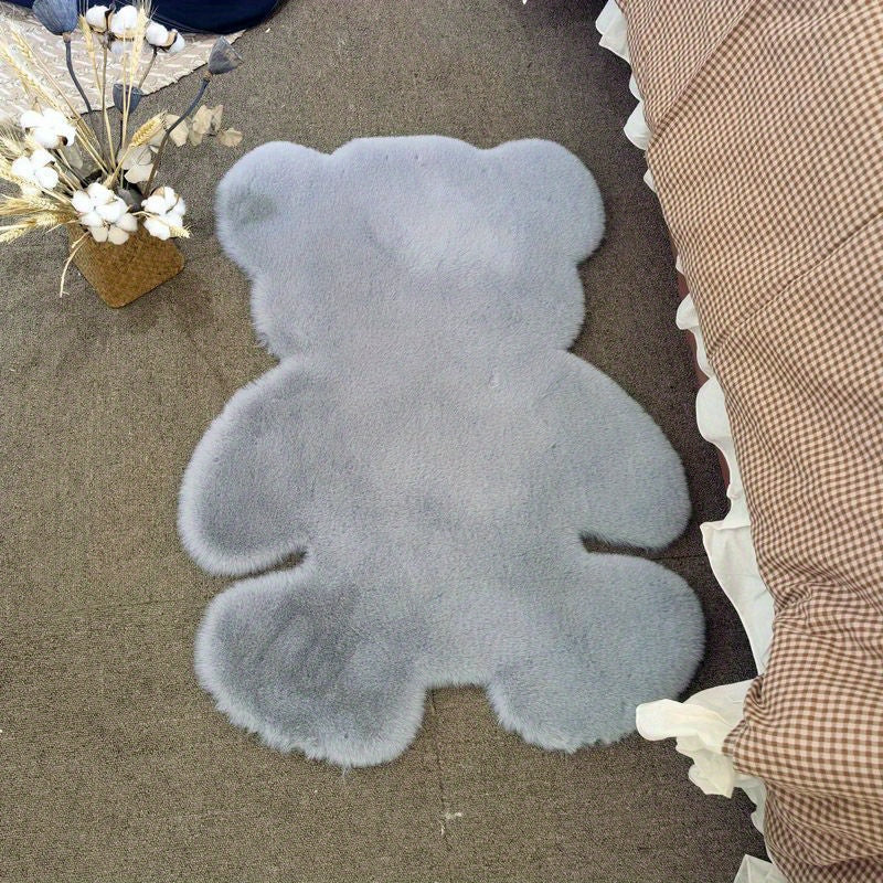 Bear-shaped area rug, featuring a cute animal pattern and fluffy cushioning, designed for softness and comfort. This soft furry throw carpet doubles as an anti-fatigue floor mat, perfect for use in high traffic areas. Ideal for adding a touch of spring