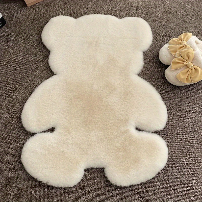 Bear-shaped area rug, featuring a cute animal pattern and fluffy cushioning, designed for softness and comfort. This soft furry throw carpet doubles as an anti-fatigue floor mat, perfect for use in high traffic areas. Ideal for adding a touch of spring