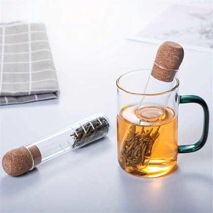 Heat resistant glass tea strainer with transparent steeper tube for loose leaf tea - perfect for home and office use! Sustainable and reusable tea accessory.