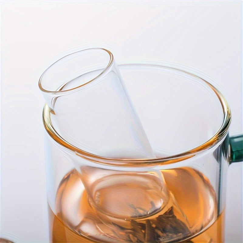 Heat resistant glass tea strainer with transparent steeper tube for loose leaf tea - perfect for home and office use! Sustainable and reusable tea accessory.