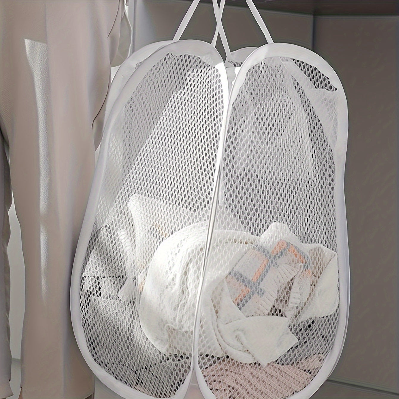 A spacious pop-up laundry hamper with a convenient handle, foldable mesh basket for storing dirty clothes. The perfect household solution and a great gift idea for Easter, Halloween, or Christmas.