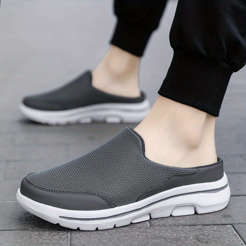 Breathable men's mules in black and white with cushioned insole for comfortable walking.