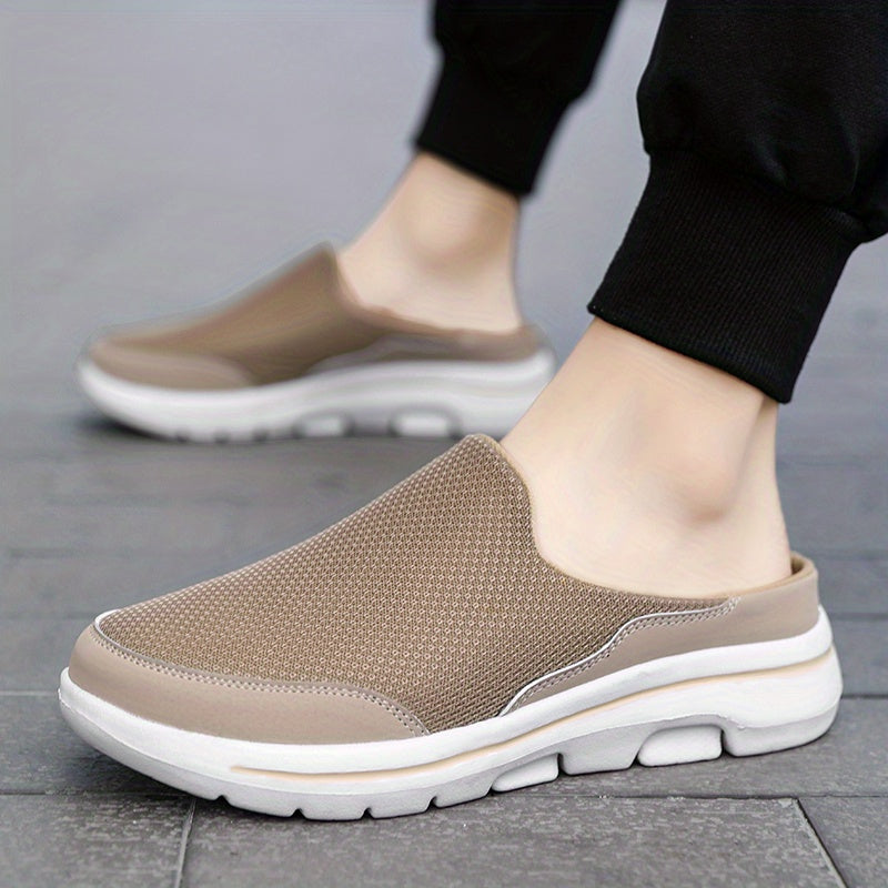 Breathable men's mules in black and white with cushioned insole for comfortable walking.