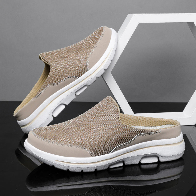 Breathable men's mules in black and white with cushioned insole for comfortable walking.