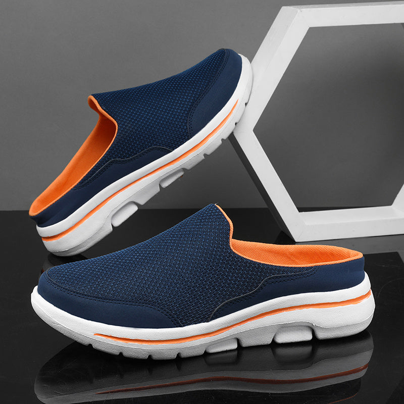 Breathable men's mules in black and white with cushioned insole for comfortable walking.