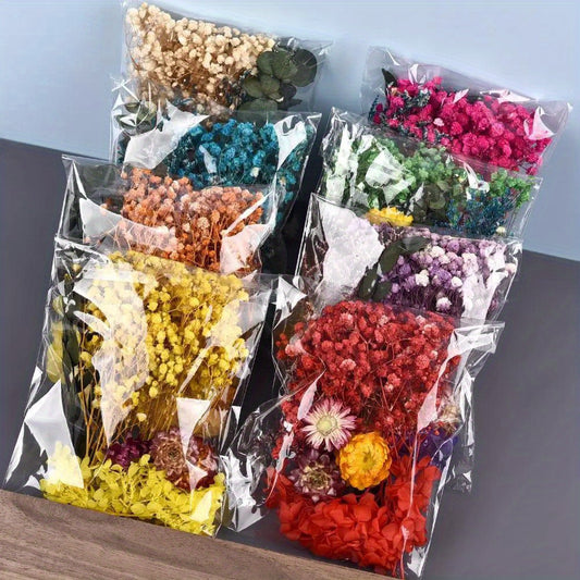 Assorted flowers, preserved materials, and epoxy resin fillers for DIY floral projects.