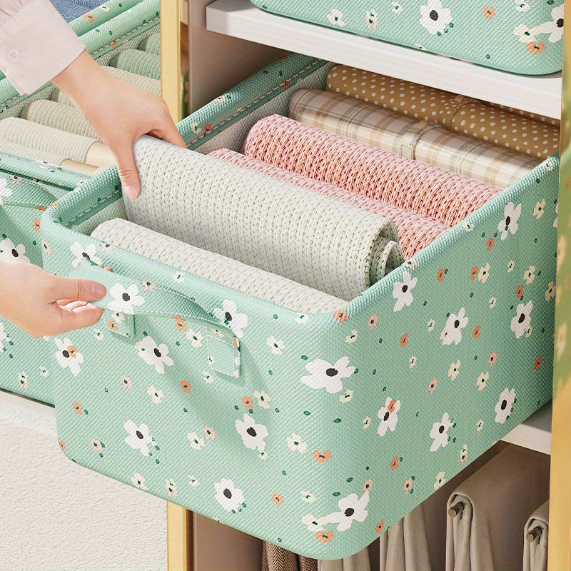 Small Flower Storage Box is perfect for organizing clothes and other items in your household. It can be used in the living room, dormitory, or any other room. This box is great for storing clothes, pants, and other fabric items.