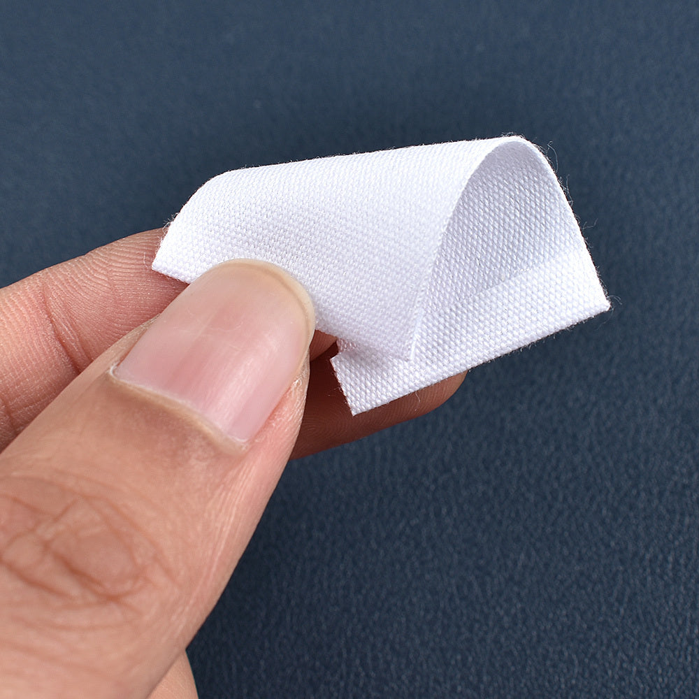 Set of 48 white fabric labels for clothing and packaging decoration.